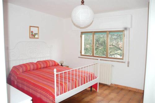Cama o camas de una habitación en Casa Caterina- Pratoranieri Follonica