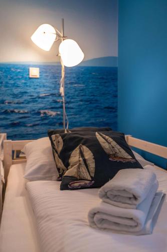 Ένα ή περισσότερα κρεβάτια σε δωμάτιο στο Apartments Faro & Mondo