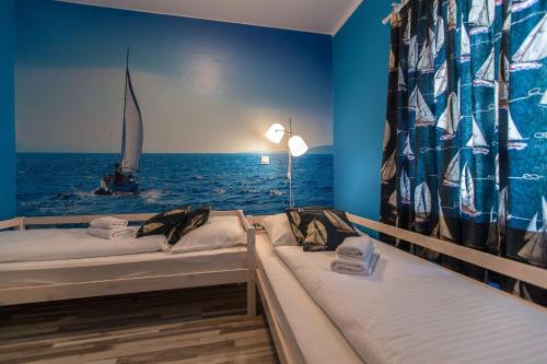 Ένα ή περισσότερα κρεβάτια σε δωμάτιο στο Apartments Faro & Mondo