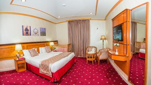 Postel nebo postele na pokoji v ubytování Amjad Al Deafah Hotel