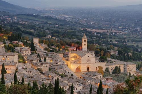 an aerial view of a town with a church at Hotel La Rocca in Assisi