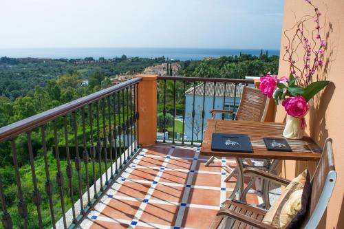 a balcony with a table and chairs and a view at The Marbella Heights Boutique Hotel in Marbella