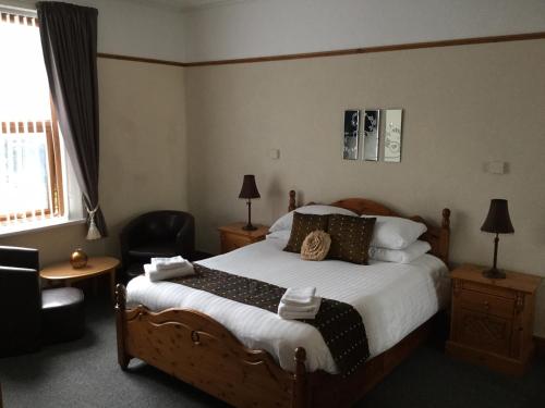Кровать или кровати в номере Woodlands Guest House