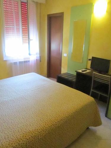 Postel nebo postele na pokoji v ubytování Albergo La Mimosa