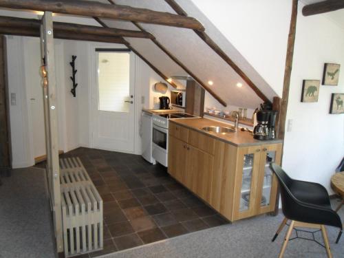 a kitchen with a sink and a counter top at Lille Degnbøl in Degnbøl
