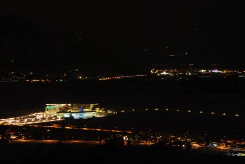a night view of a large boat in the water at Pension Christophorus in Kaprun