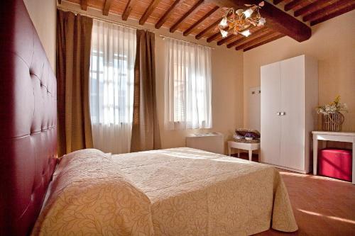 a bedroom with a large bed in a room at Tenuta San Giovanni Lucca in Lucca