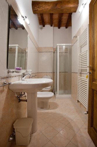 a bathroom with a sink and a shower and a toilet at Tenuta San Giovanni Lucca in Lucca