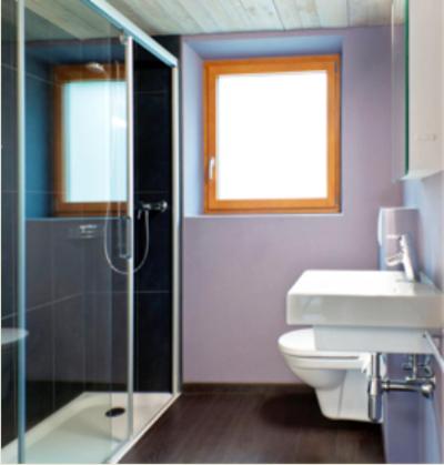a bathroom with a shower and a toilet and a sink at Casa al Lido in Locarno