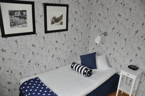 Postel nebo postele na pokoji v ubytování Strand Hotell