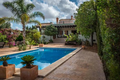 an exterior view of a house with a swimming pool at La Princesa in Atamaría
