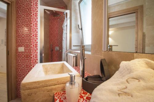 a bathroom with a sink and a mirror at Casa Martina in Monopoli