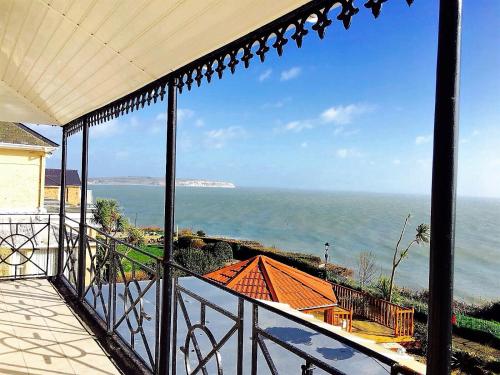 a view of the ocean from the balcony of a house at Villa Mentone Hotel in Shanklin