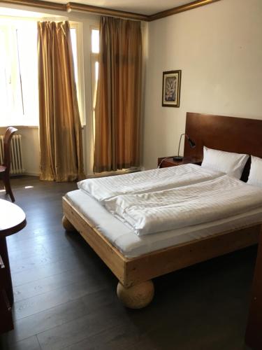 Кровать или кровати в номере Hotel Zollhof