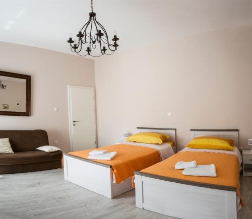 Ένα ή περισσότερα κρεβάτια σε δωμάτιο στο Pavelin apartments