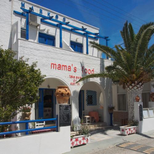 a building with a sign that reads manamas food at Villa Markos in Perissa