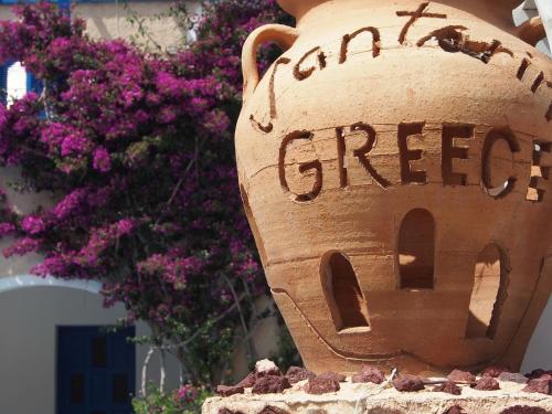 a vase with the words amazon green written on it at Villa Markos in Perissa