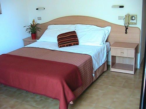 Postel nebo postele na pokoji v ubytování Hotel Universo
