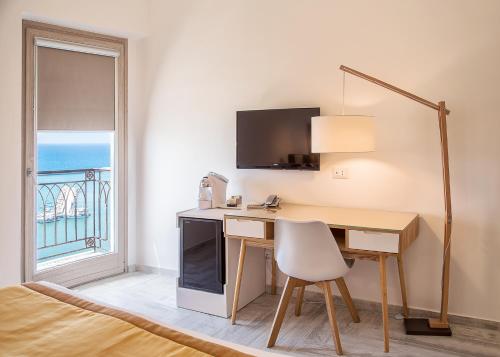 Postel nebo postele na pokoji v ubytování Domus Maris Relais Boutique Hotel