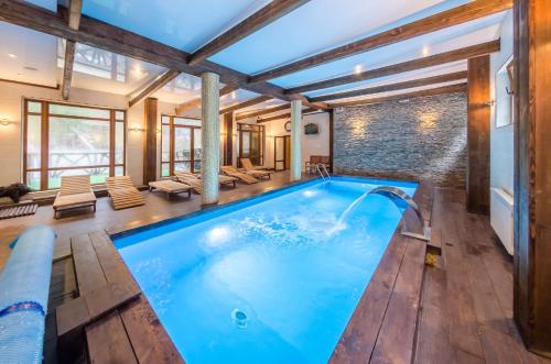 a swimming pool in a house at ZimaSnow Ski & Spa Club in Bukovel