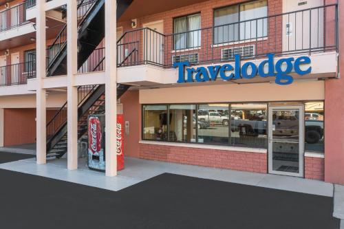 a travelodge building with a coca cola sign at Travelodge by Wyndham Reno in Reno