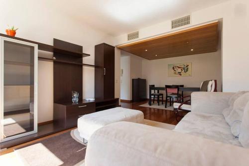 a living room with a couch and a table at Apartamento Expo in Lisbon