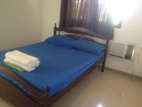 Postel nebo postele na pokoji v ubytování Rullan Apartelle