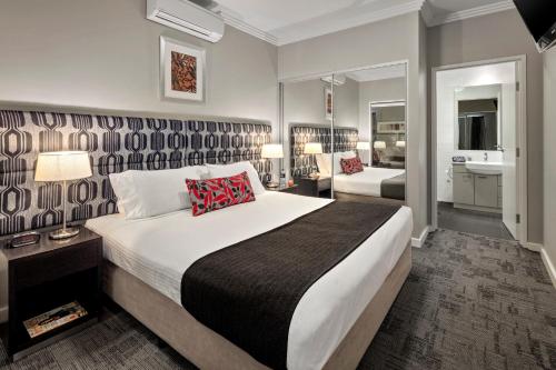 מיטה או מיטות בחדר ב-Quest Campbelltown