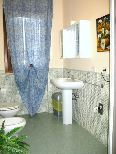 a bathroom with a sink and a toilet at AFFITTACAMERE La Tartaruga in Civitanova Marche