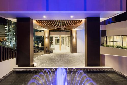 a large room with a large fountain in the middle of it at Sofitel Wellington in Wellington