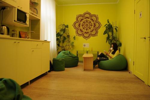 a woman sitting on bean bags in a room at KashEmir in Kyiv