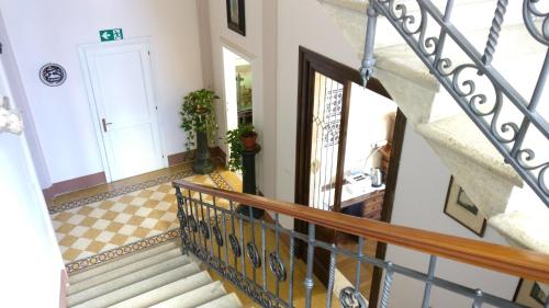 a staircase in a home with a white door at La Chicca B&B Siena in Siena