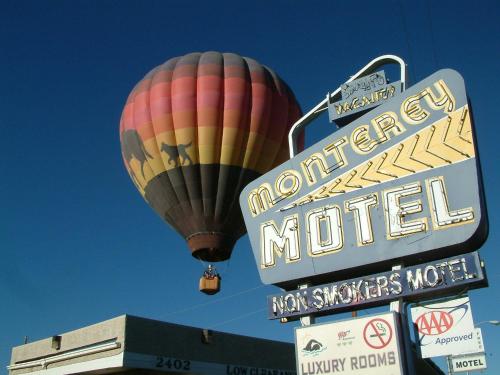 a hot air balloon flying over a motel sign at The Monterey Motel in Albuquerque