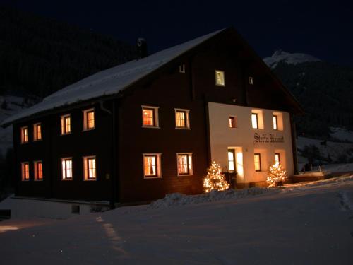 a building with christmas trees in front of it at Steffa Hamat in Ischgl