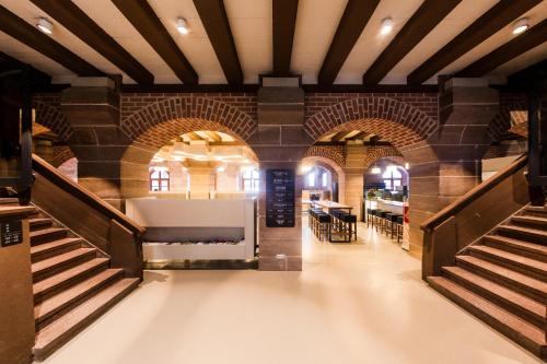 a large room with a staircase in a building at Jugendherberge Nürnberg - Youth Hostel in Nürnberg