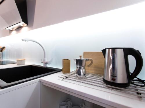 a coffee pot sitting on a counter in a kitchen at Il Nido Del Mangia in Siena