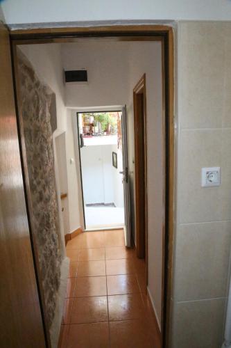 a hallway with a door leading into a room at Apartments Seka in Hvar