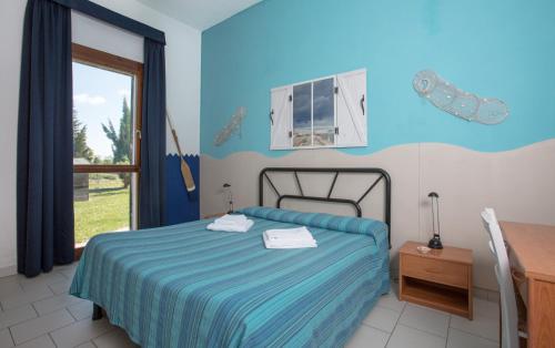 A bed or beds in a room at Il Lato Azzurro