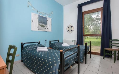 a bedroom with a blue bed and blue walls at Il Lato Azzurro in Venice