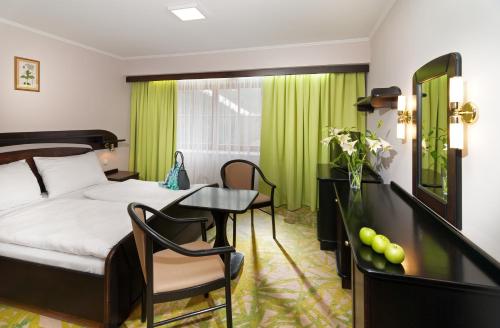 Postel nebo postele na pokoji v ubytování Hotel Zátiší