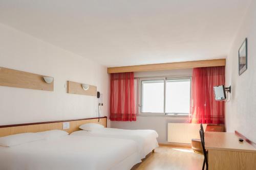 Postel nebo postele na pokoji v ubytování greet hotel Grenoble Centre Gare
