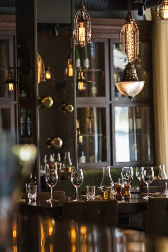 a group of wine glasses sitting on a bar at Best Western Hotel Norrkoping City in Norrköping