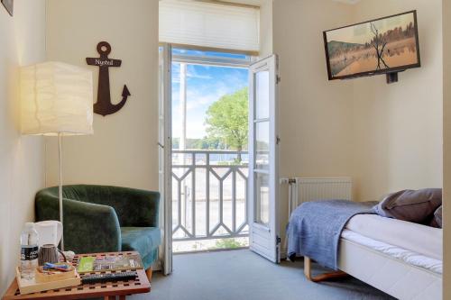 Postel nebo postele na pokoji v ubytování Hotel Nysted Havn