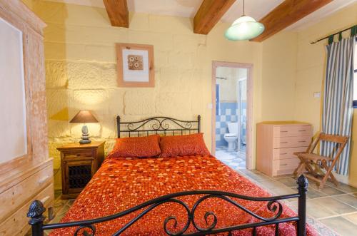 Krevet ili kreveti u jedinici u objektu Il-Wileġ Bed & Breakfast