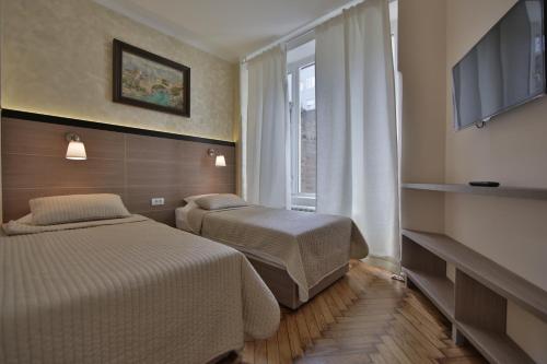 En eller flere senge i et værelse på Apartment Alek