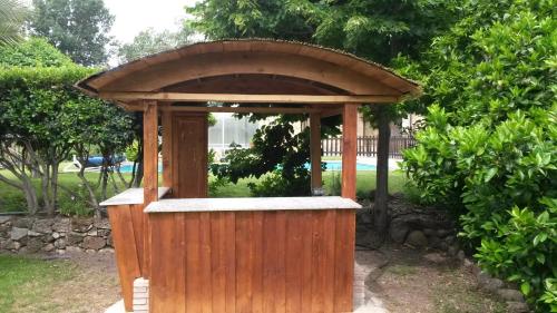 a wooden gazebo with a roof at Los Montejos & Spa in Valverde del Fresno