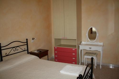 Un pat sau paturi într-o cameră la La Pavoncella