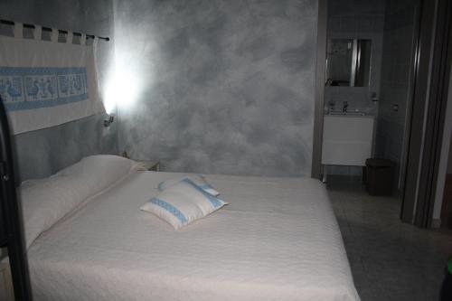 Una cama o camas en una habitación de La Pavoncella