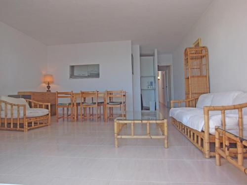 a bedroom with a bed and a table and chairs at Soling 5 in La Manga del Mar Menor