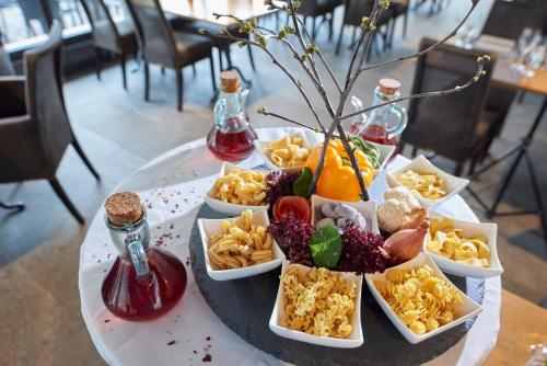 a table with a tray of food on a table at Hotel Restaurant Rathaus in Thun